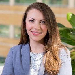 Female population health sciences student, and UMMC's Executive Director of Research, poses in her translational research center office.